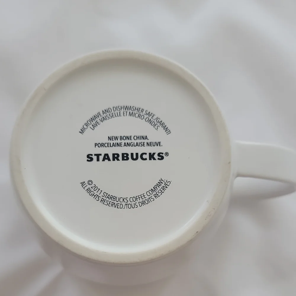 Starbucks 2011 New Bone China White Coffee Mug W/ Yellow Liner.